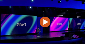 Dr. Swami Sivasubramanian, VP of AI and Data at AWS, delivering a keynote at AWS 2024 Re:Invent on the impact of GenAI in education. A play button is visible, allowing viewers to watch the featured video from the event.