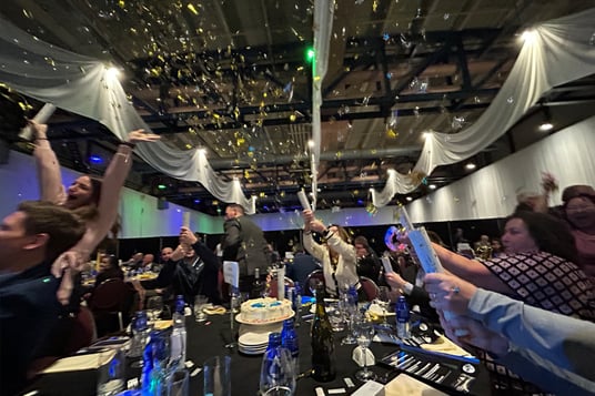 Top 100 Team Celebration at Mindex table