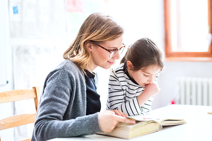 teacher with student focused on reading-1